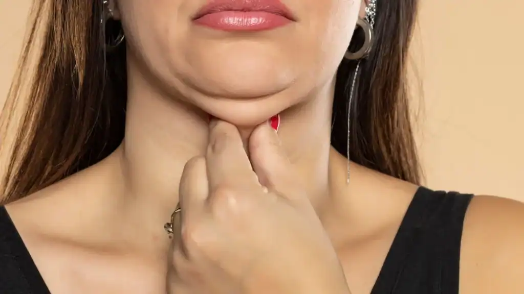 An image of a woman with double chin, sad, worried : Non Surgical Double Chin Removal Treatment in Hampton, UK